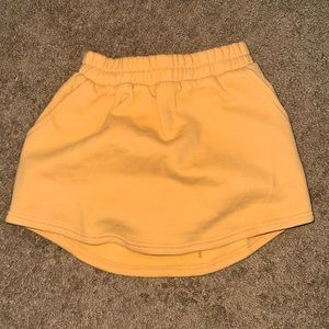 adult size small,gold hinge skirt,peach color,never worn